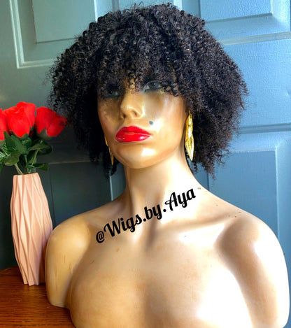 Kinky curly closure human hair wig.